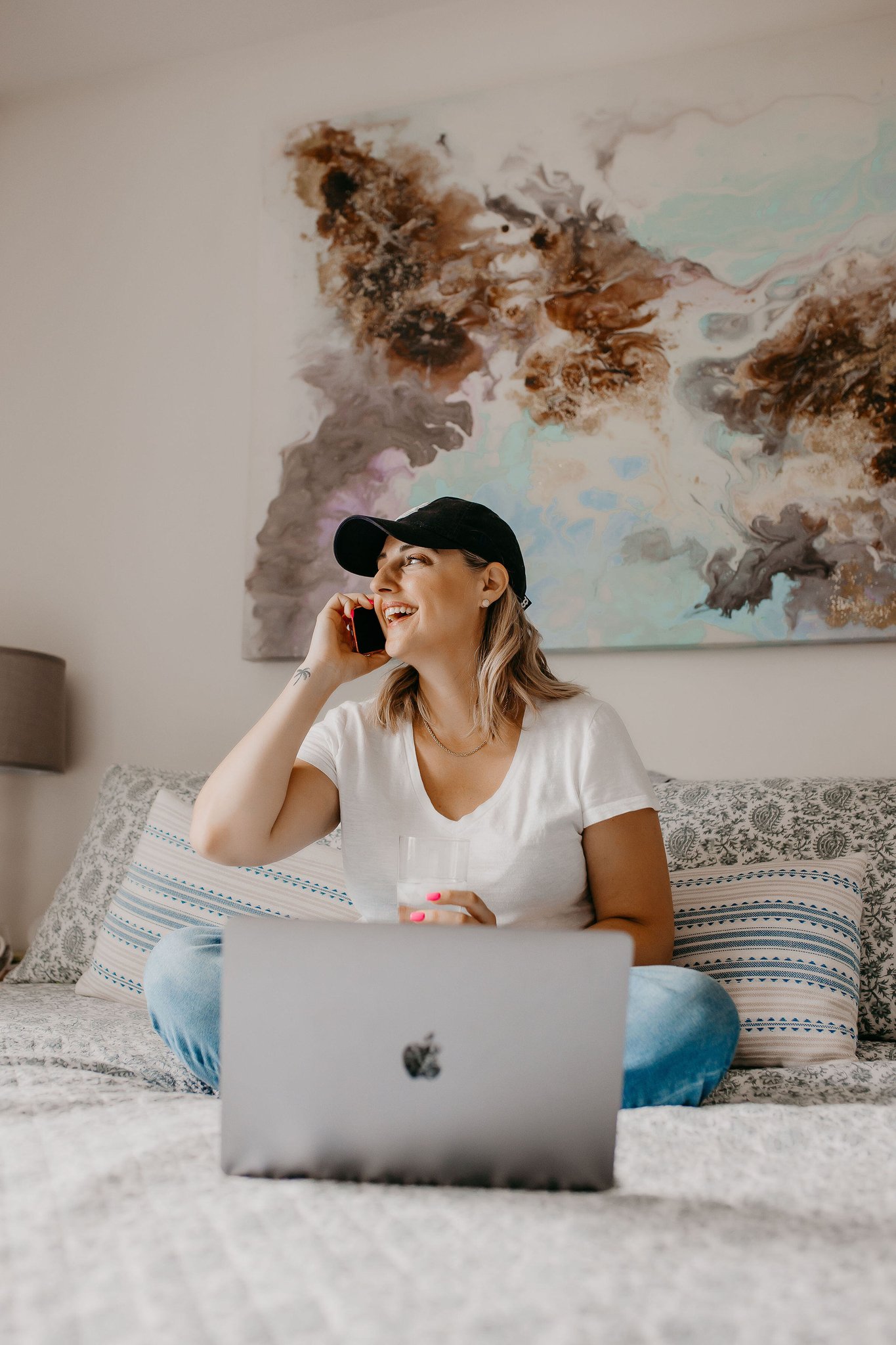Kate Hanson with a laptop, talking on her phone